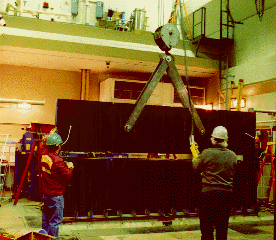 Photo of lower yoke pack being lifted on crane.