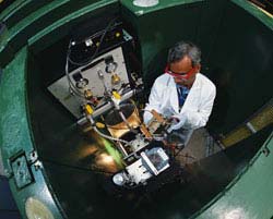 Muhammad Arif working on fuel cell testing equipment at the Neutron Imaging Facility